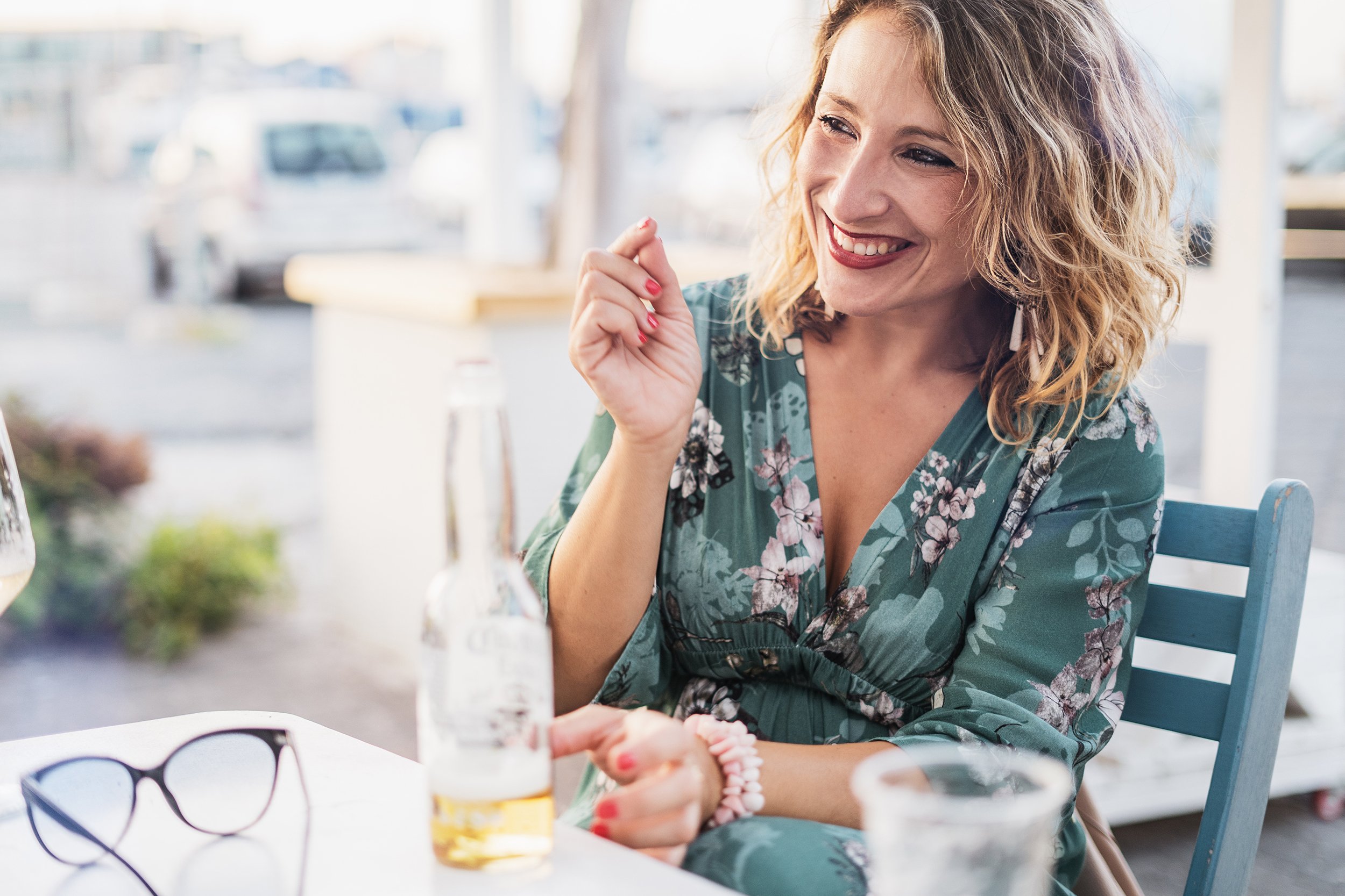 Woman in her 40s enjoying a liquor during daytime