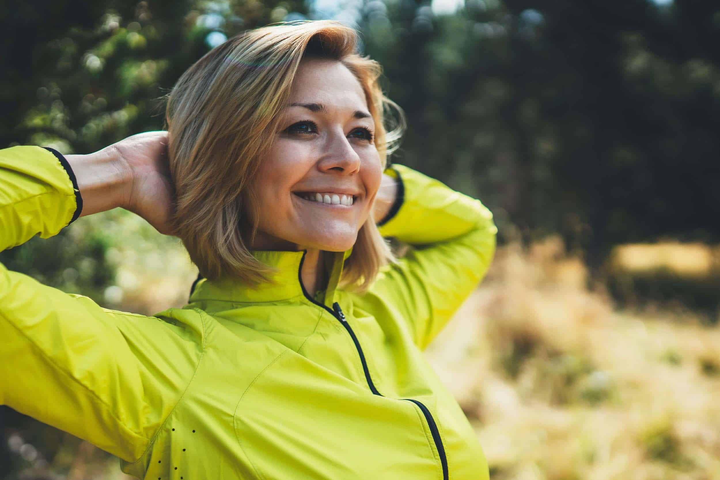smiling middle-aged woman exercises to become healthy