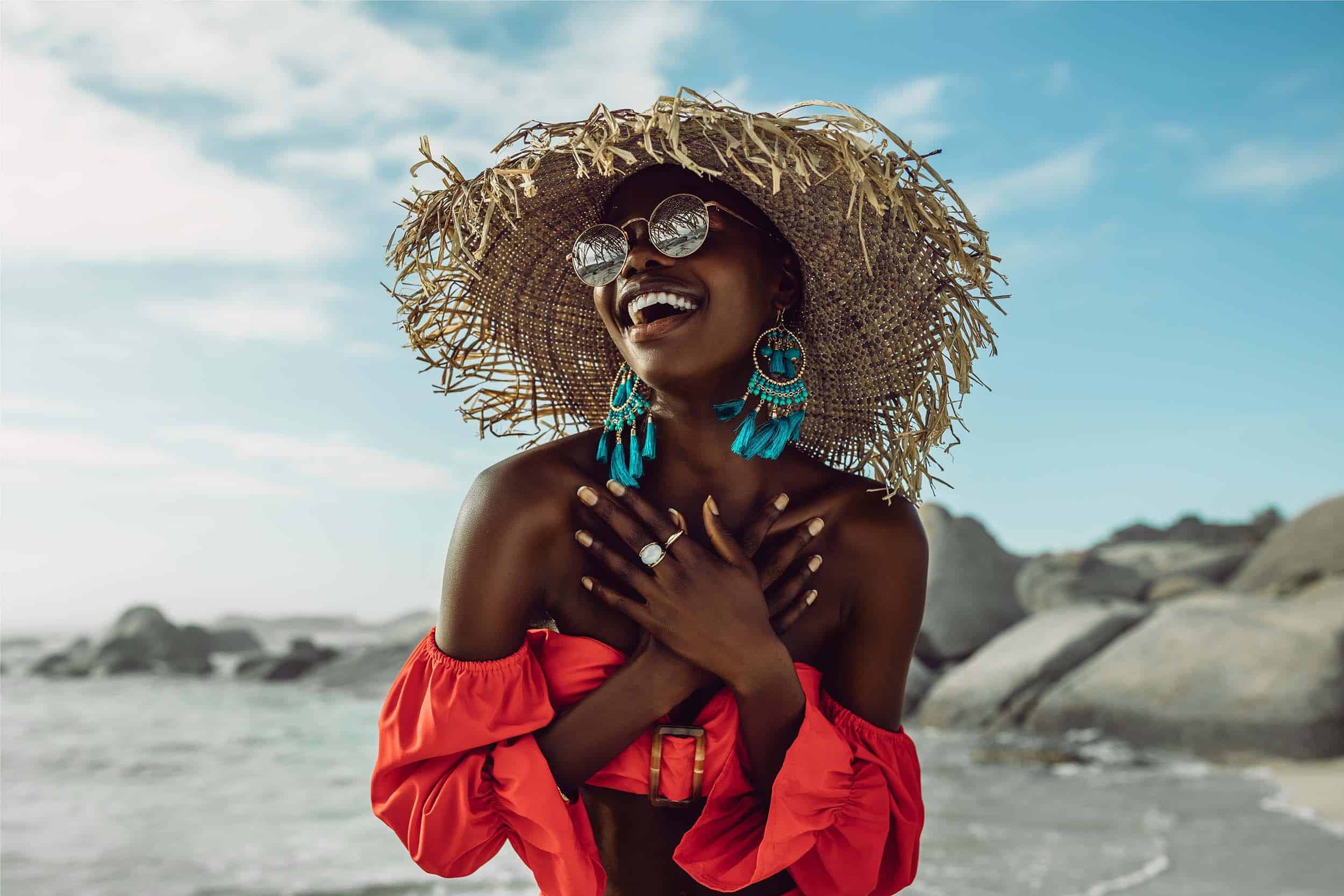 stylish woman in summer outfit looks carefree and happy