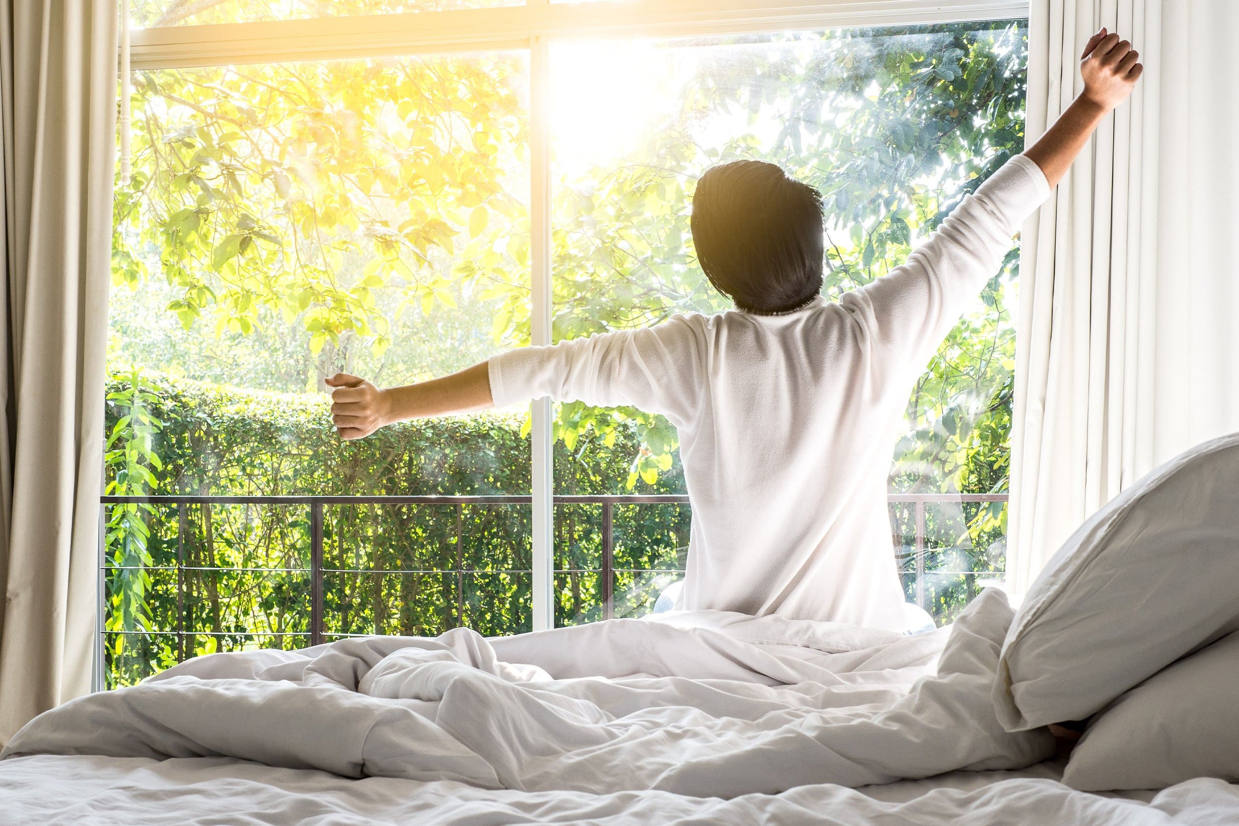 Man waking up fresh and with enthusiasm