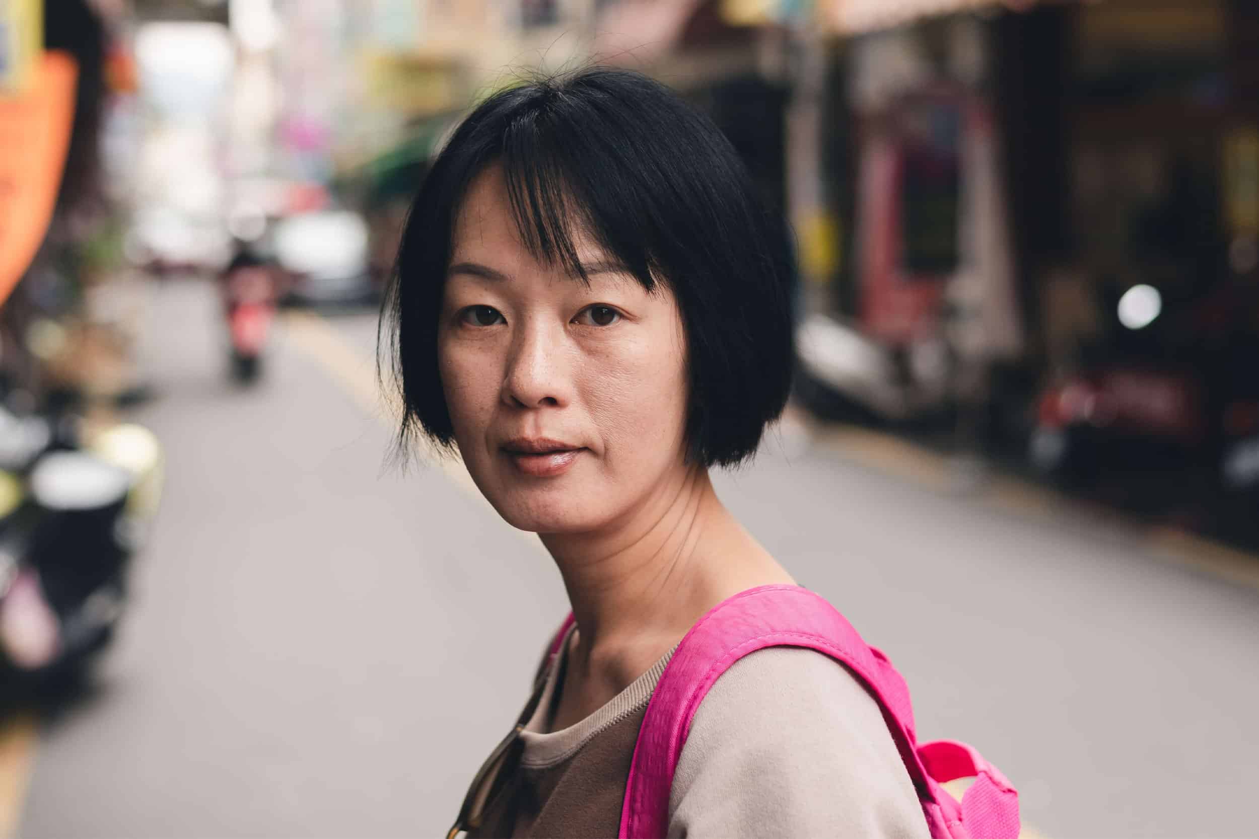 mature asian woman traveling alone