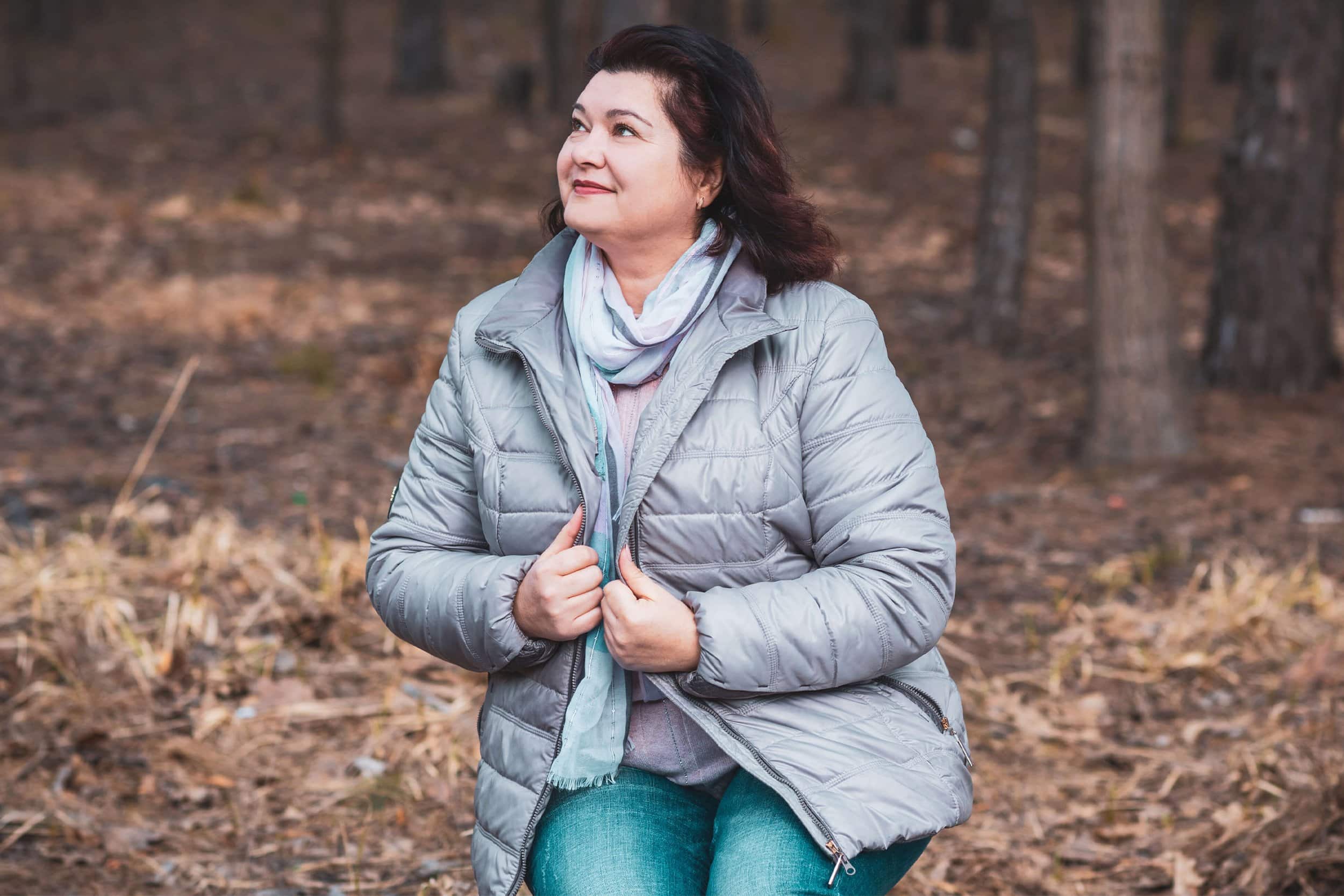 woman on a sweater in the cold forest