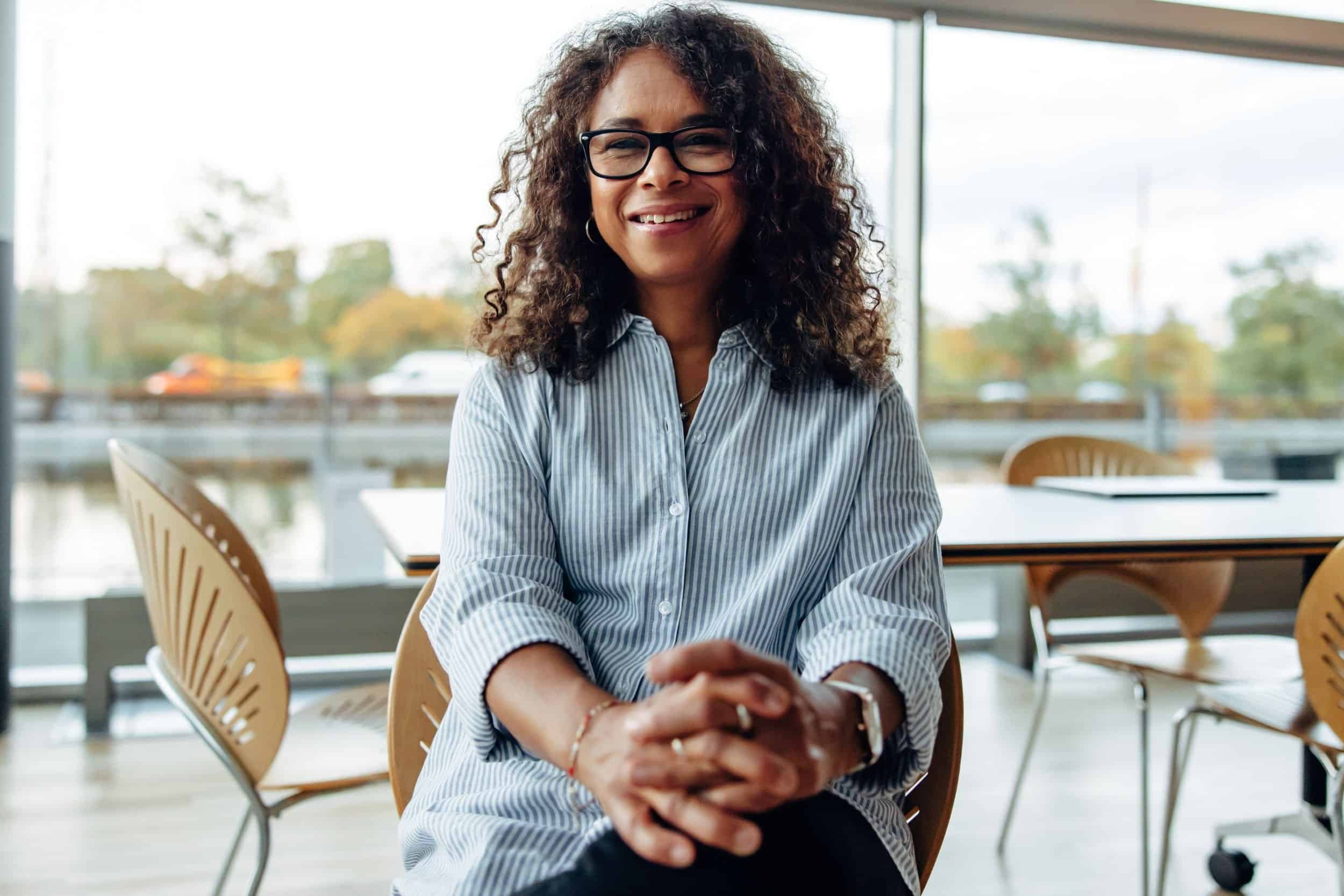 woman in her 40s posing in a relax posture