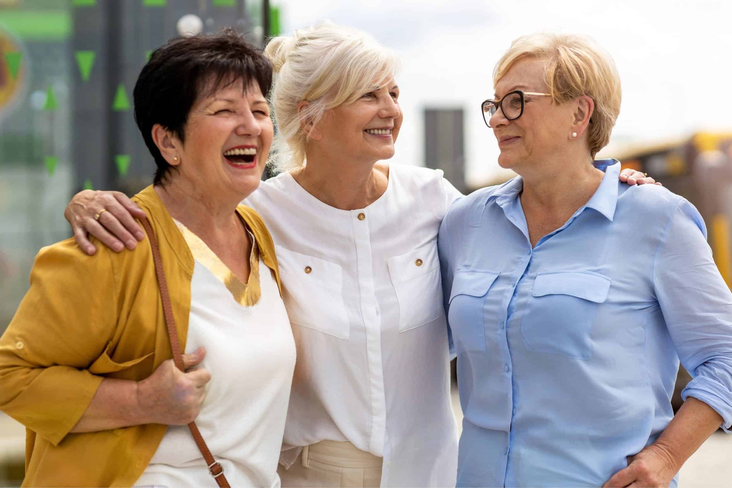 group of women in their 50s talking with each other cheerfully