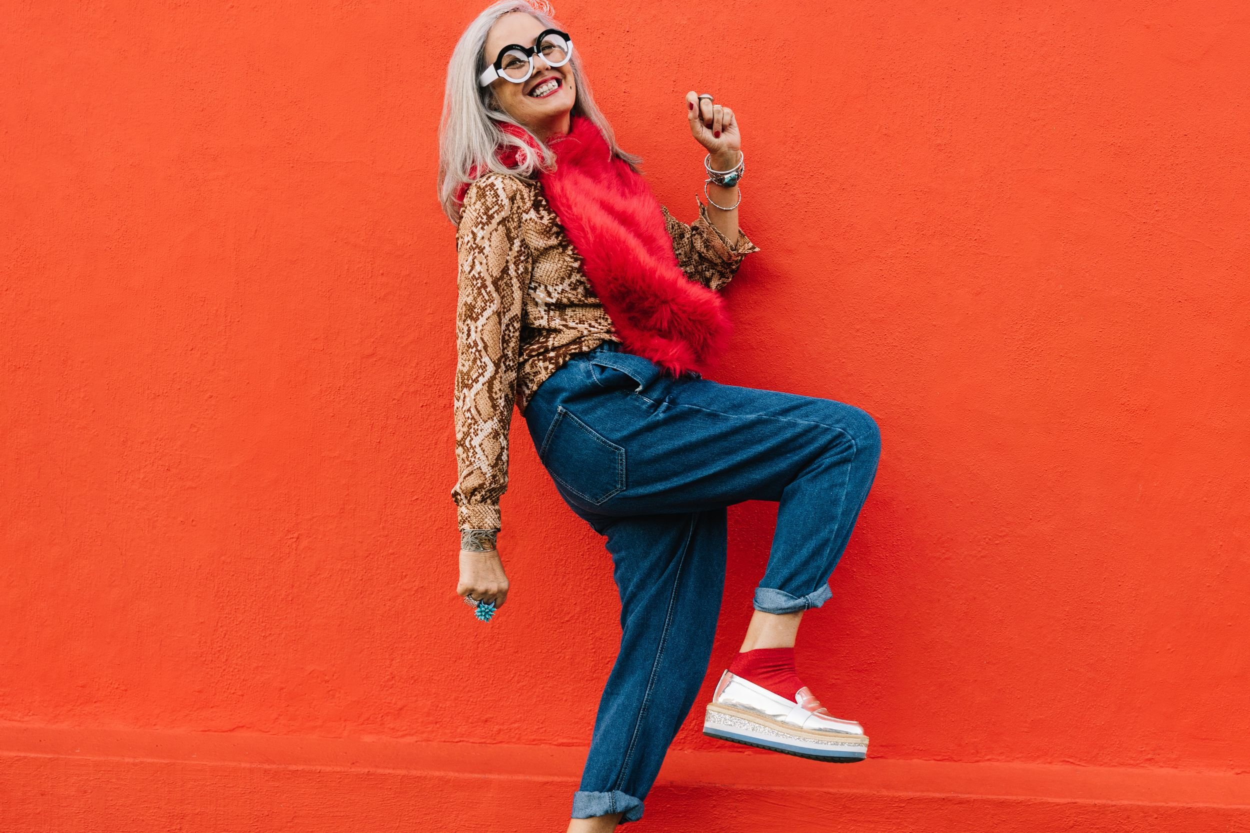 woman in her 40s wearing creative clothes posing playfully