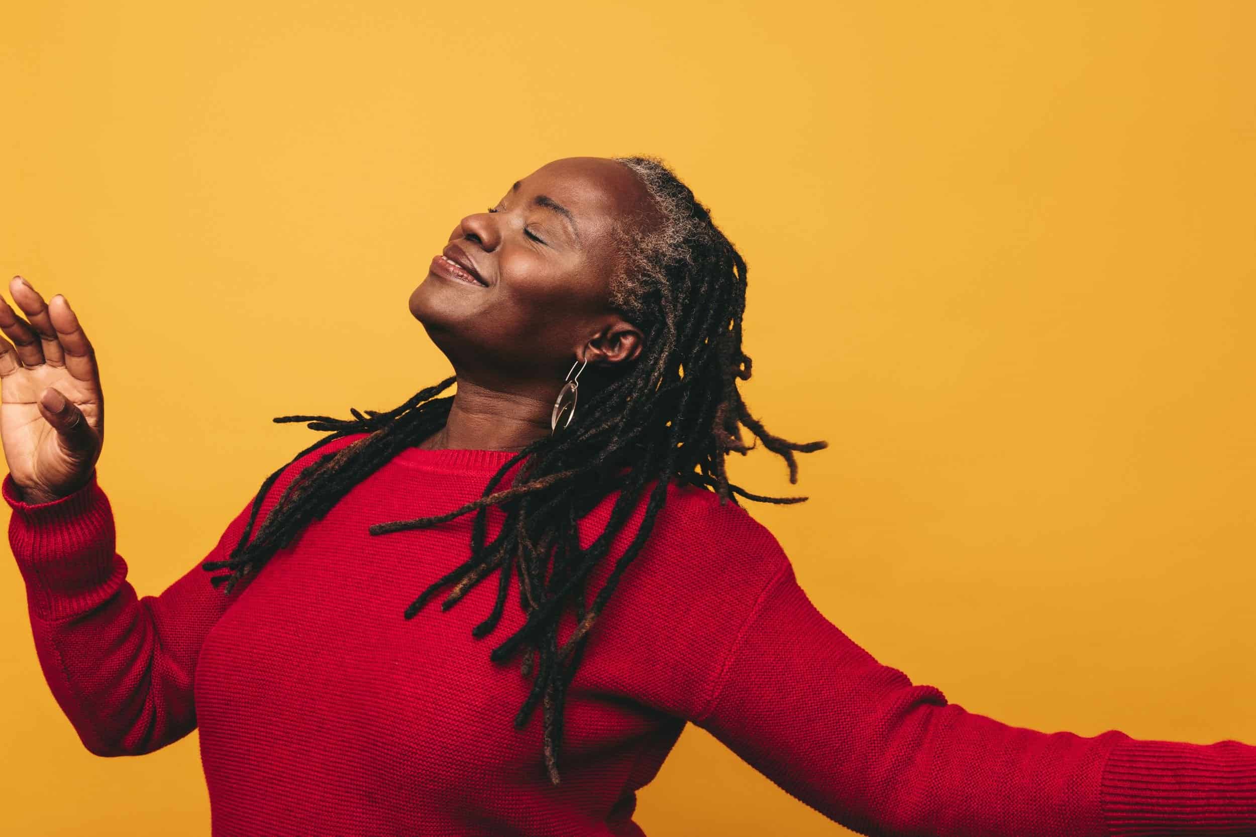 woman in her 40s playfully posing having a relax smile