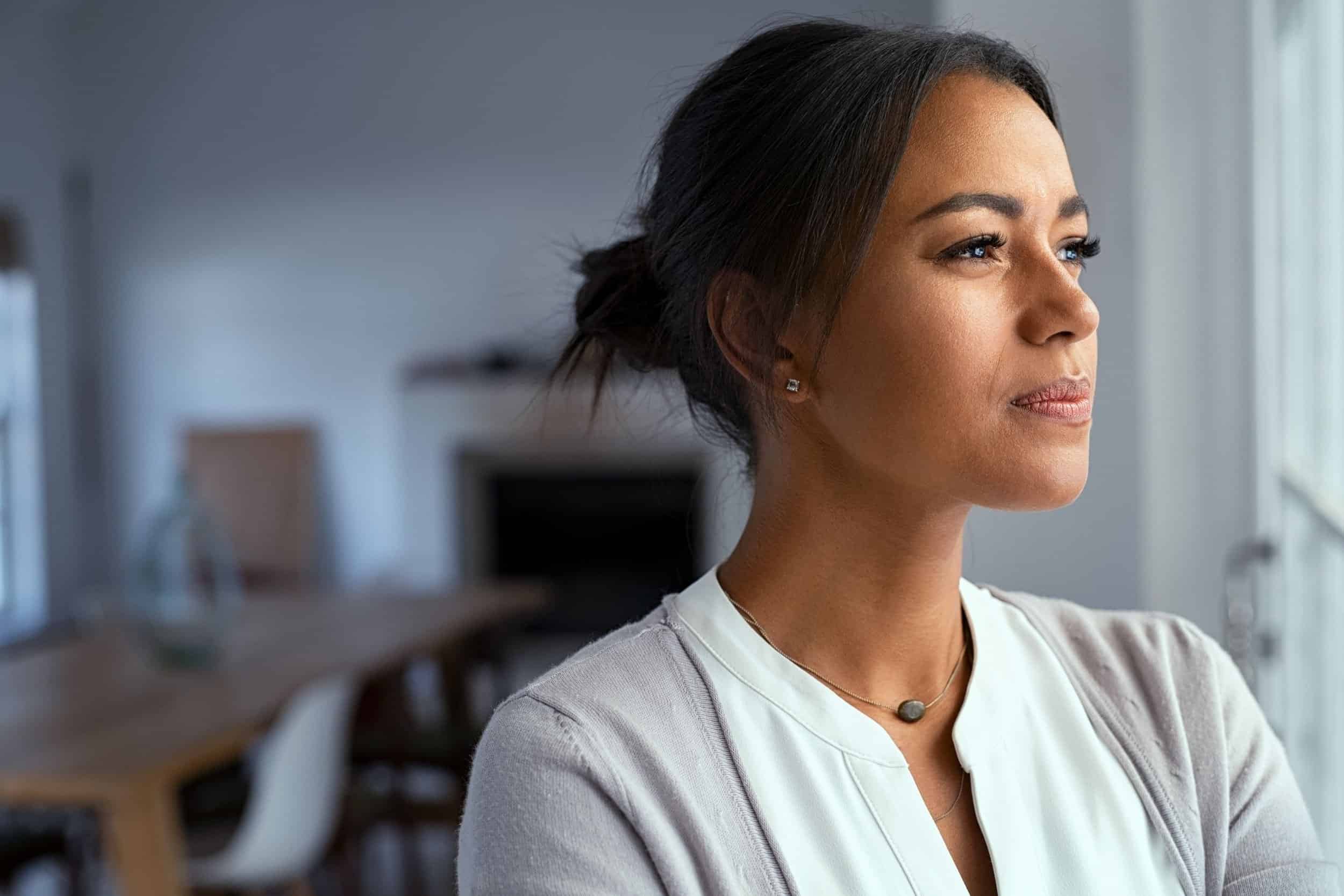 woman looking in the window wondering life